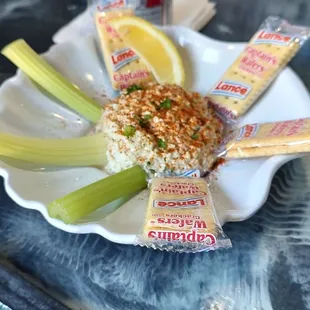 a plate of food with celery sticks