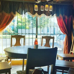 a dining room with a table and chairs