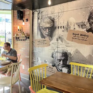 a man sitting at a table in a restaurant