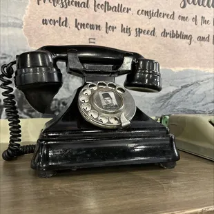 an old telephone on a desk