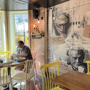 a man sitting at a table in a restaurant