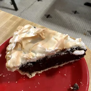 a slice of pie on a red plate