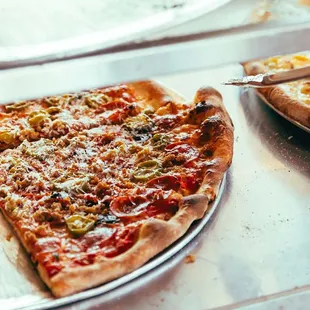 a slice of pizza on a pan