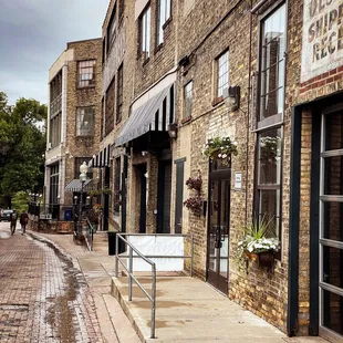 a brick building and sidewalk