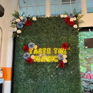 a sign that says taste the magic