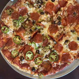 Deluxe pizza minus mushrooms, plus jalapeños &amp; garlic.