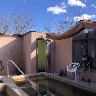 Hot hot tub with shower in background