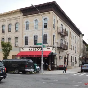 a street corner with parked cars