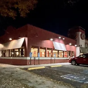 the outside of a restaurant at night