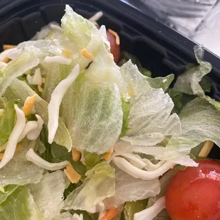 a salad in a plastic container