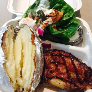 Medium NY strip, baked potato, and wedge salad with applewood smoked bacon and Gouda cheese.