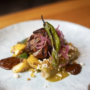 a plate of food on a wooden table
