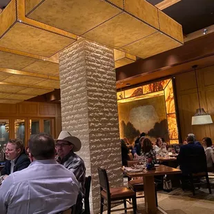 a large group of people sitting at tables