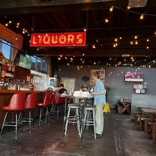 people sitting at tables in a restaurant