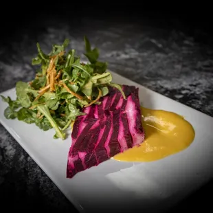 Beet &amp; Goat Cheese Terrine
roasted beet &amp; smoked goat cheese terrine with baby arugula, crispy potato sticks, and orange vinaigrette