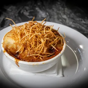 Lamb Cottage Pie
with roasted spring vegetables, mashed potatoes, red wine demi-glacé, and crispy potato straws