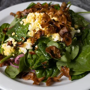 Warm Spinach Salad
with roasted tomatoes, pickled red onion, mushroom chips, grated egg, and warm bacon vinaigrette