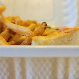 View from the side of a lobster roll - can only see bread