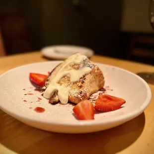 a plate of food and a glass of wine