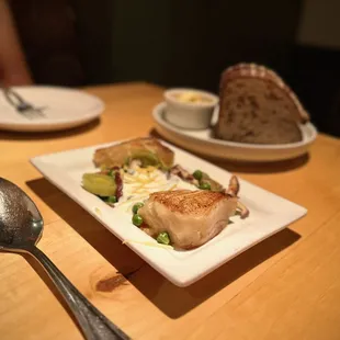 a plate of food on a wooden table