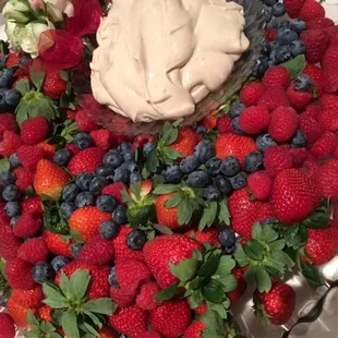 ows strawberries, blueberries, raspberries, and whipped cream