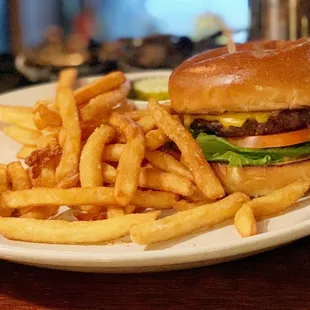 a hamburger and french fries on a plate