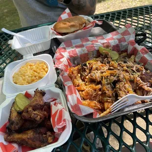 Naked wings, mac and cheese, pulled chicken sandwich and loaded fries with pulled pork