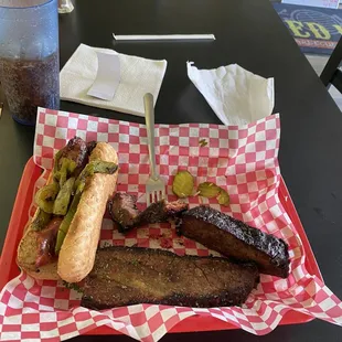 Half pound of brisket, Italian sausage with peppers, Pepsi. Would definitely recommend it all!