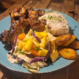 Jerk chicken
Peas an rice
Plantains 
Caribbean salad