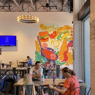 a group of people sitting at a table