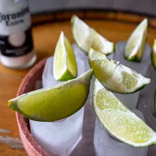 lime slices in a bowl of ice