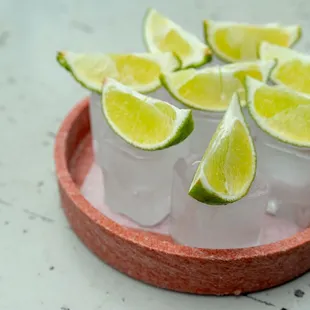 a shot of limes in ice cubes