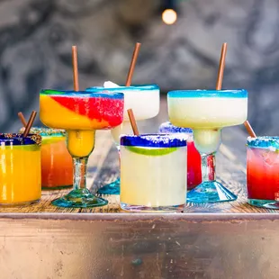 a variety of colorful cocktails