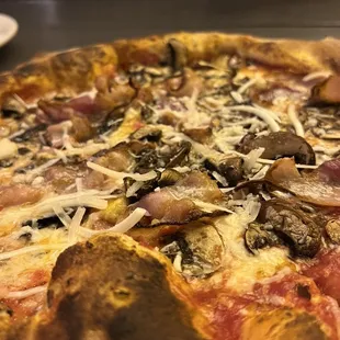 a pizza with mushrooms and cheese