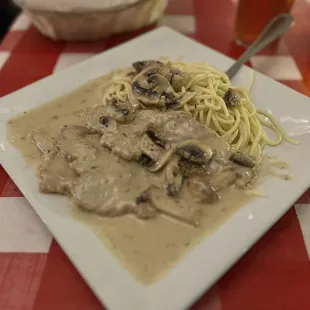 a plate of pasta and mushrooms