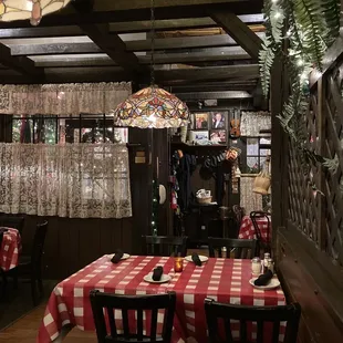 a table with a red and white checkered tablecloth