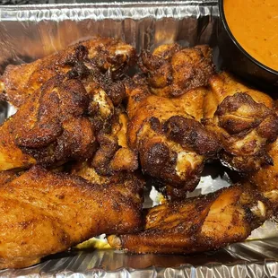 chicken wings and a side of sauce