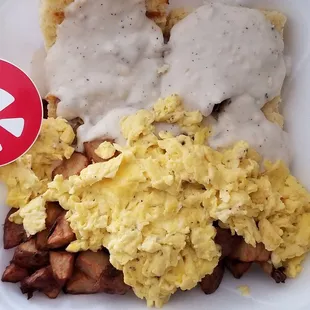 Dancing as I devour this Biscuits and gravy w/2 eggs meal from Feed.