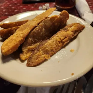 Fried in chicken grease. Awesome potato wedges.
