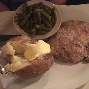 Pork Tenderloin platter with baked potato and green beans