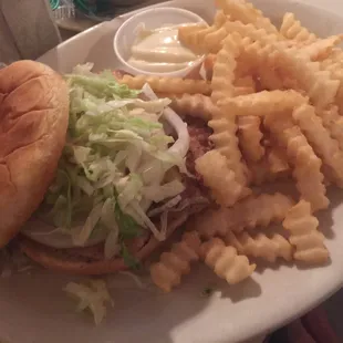 Pork tenderloin sandwich with crinkle-cut fries