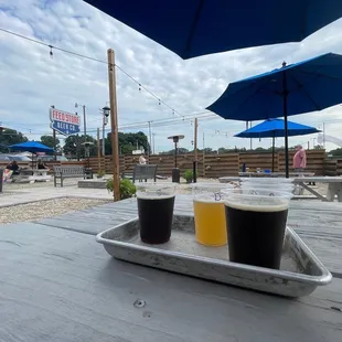 Flight on the patio, fire pit and warmers are nearby with lots of seating and corn hole for fun