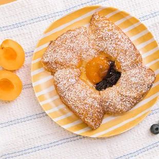 Fruit Danish

A beautiful round pastry with a cheese filling topped with blueberries and apricots.