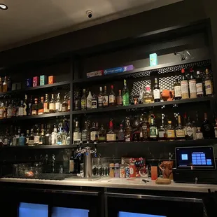 a bar with many bottles of alcohol