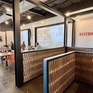 people sitting at tables in a restaurant