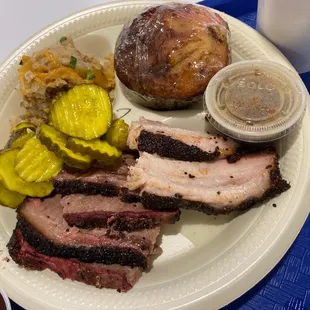 Sliced brisket, pork belly, loaded potato salad, and hog fat corn bread