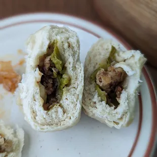 a half eaten sandwich on a plate