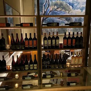 a display of wine bottles and glasses
