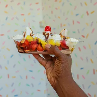 a hand holding a dessert