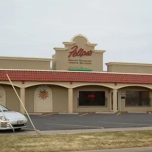 a car parked in front of the restaurant